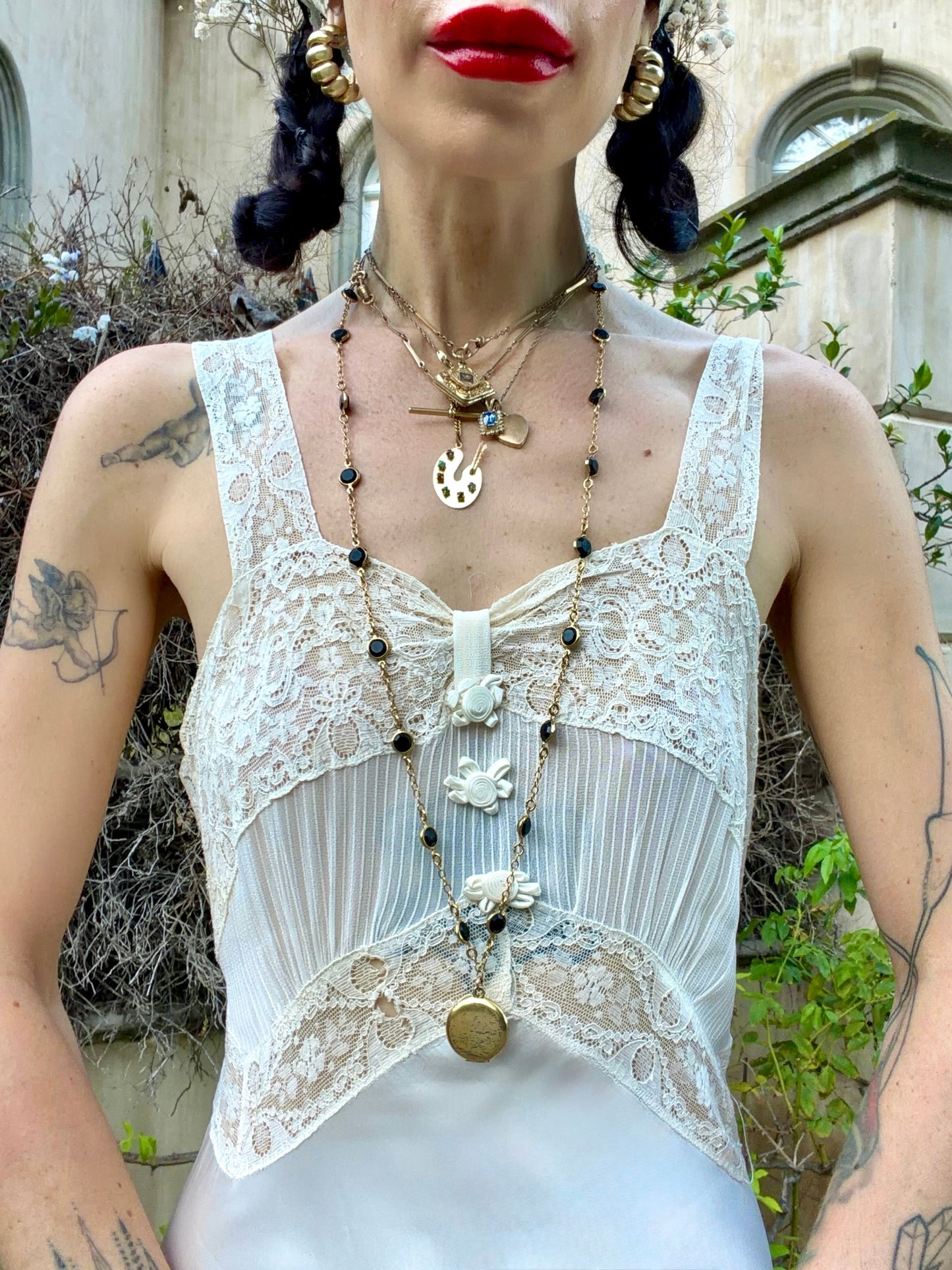 woman wearing antique 1930's silk slip gown in bone white with ivory lace and bias cut skirt