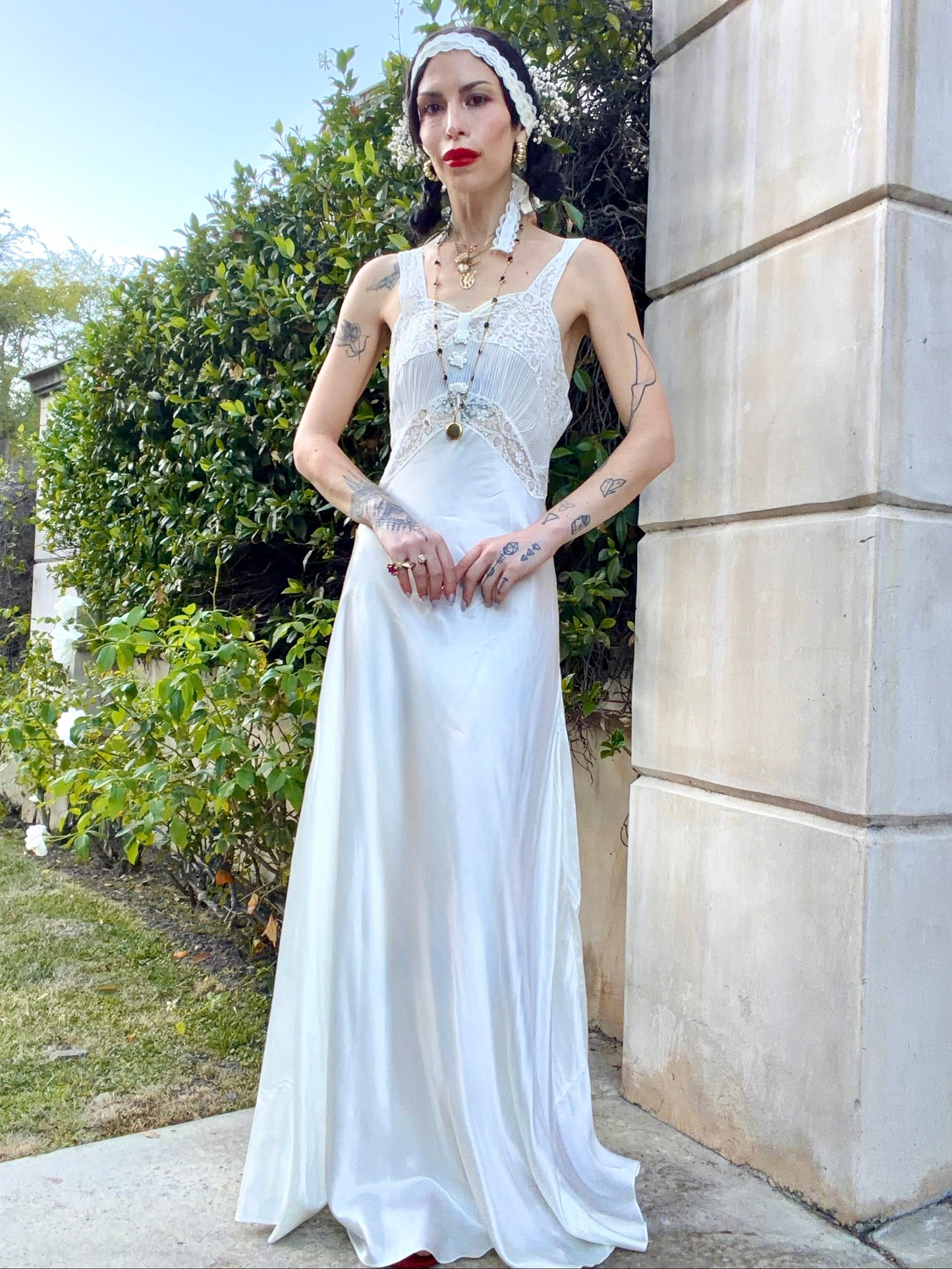 woman wearing antique 1930's silk slip gown in bone white with ivory lace and bias cut skirt