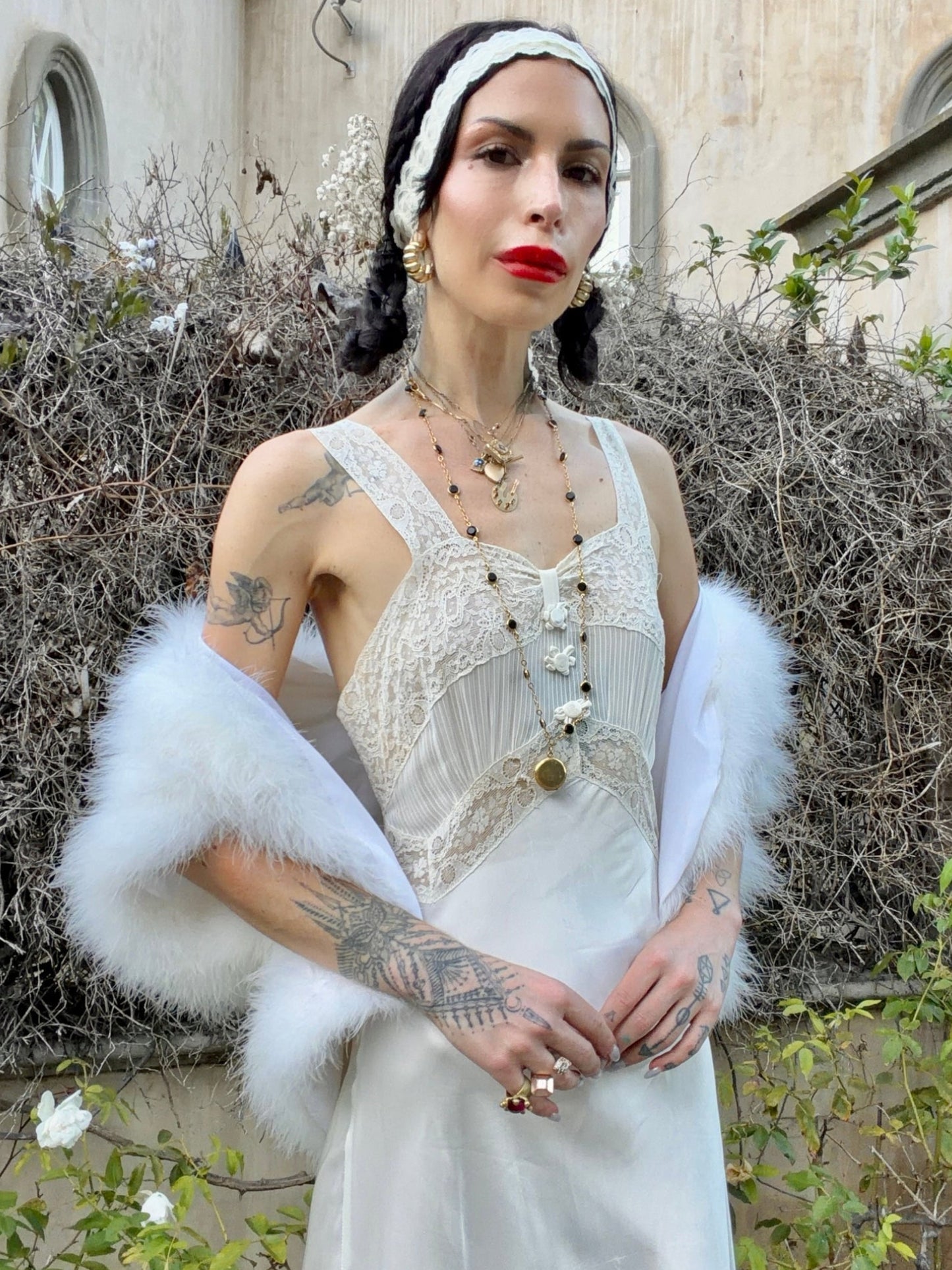 woman wearing antique 1930's silk slip gown in bone white with ivory lace and bias cut skirt