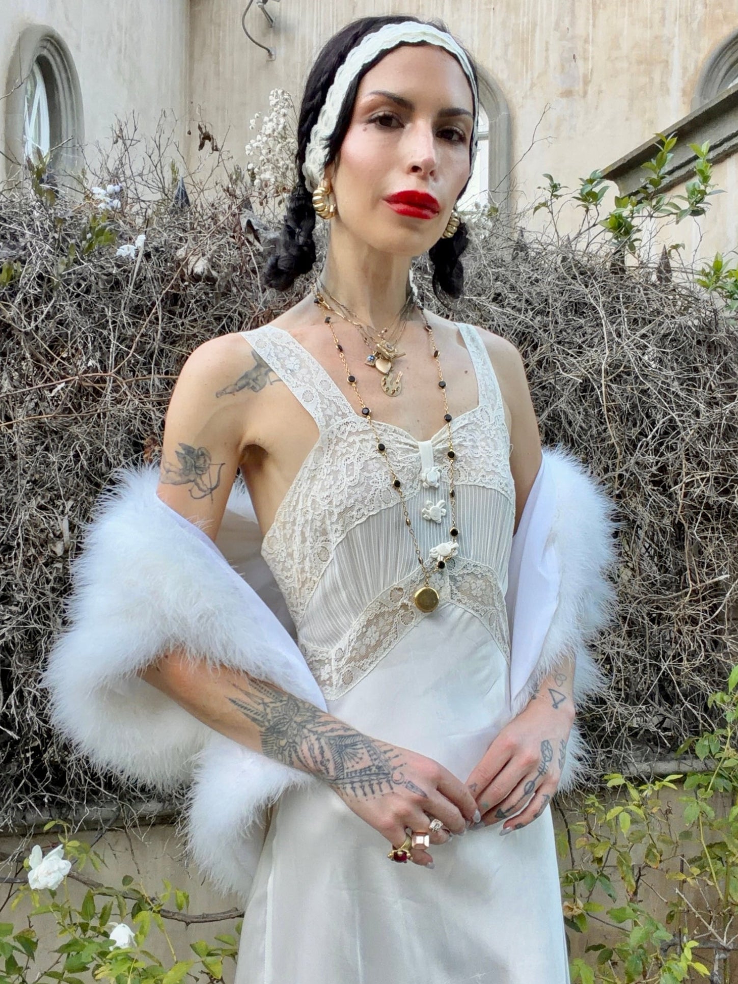 woman wearing antique 1930's silk slip gown in bone white with ivory lace and bias cut skirt