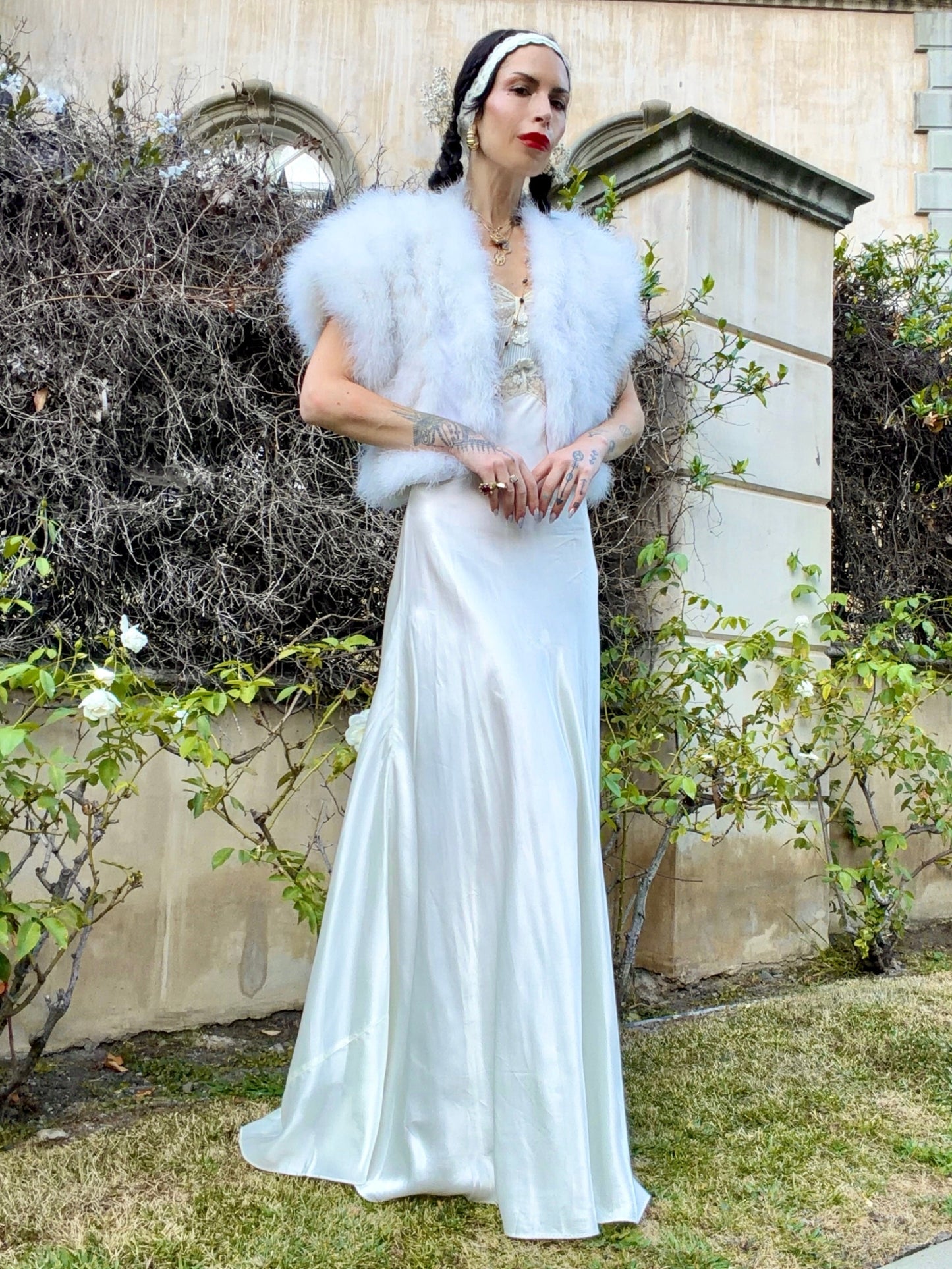 woman wearing antique 1930's silk slip gown in bone white with ivory lace and bias cut skirt